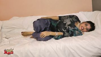 Rupali in bed in blue Indian shalwar suit teases then masturbates until her admirer explodes all over her pussy.