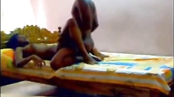Hot South Indian couple enjoying sex in their bedroom.